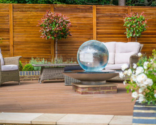 Aqualens Sphere Fountain on raised surface.