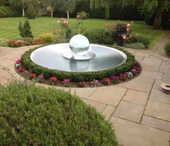 Aqualens Sphere Fountain in Harrow, London Garden