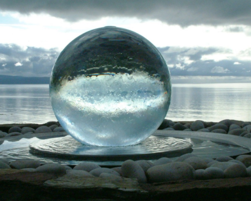 Glass Ball Fountain reflecting gray skies