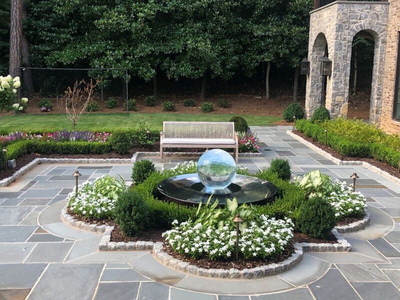 Aqualens Sphere Fountain set in a patio