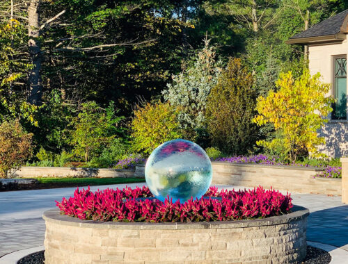 sphere-fountain-in-center-driveway-garden