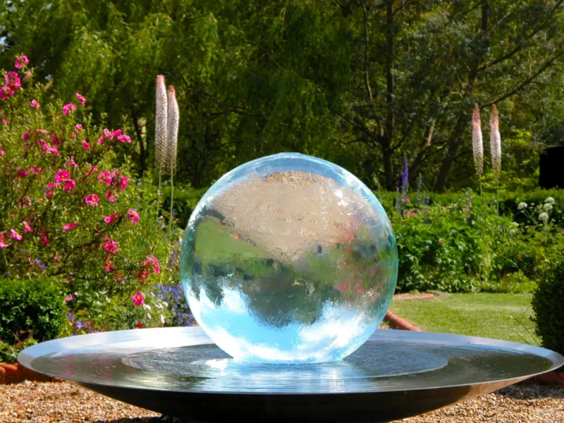 Aqualens Sphere Fountain in a Garden