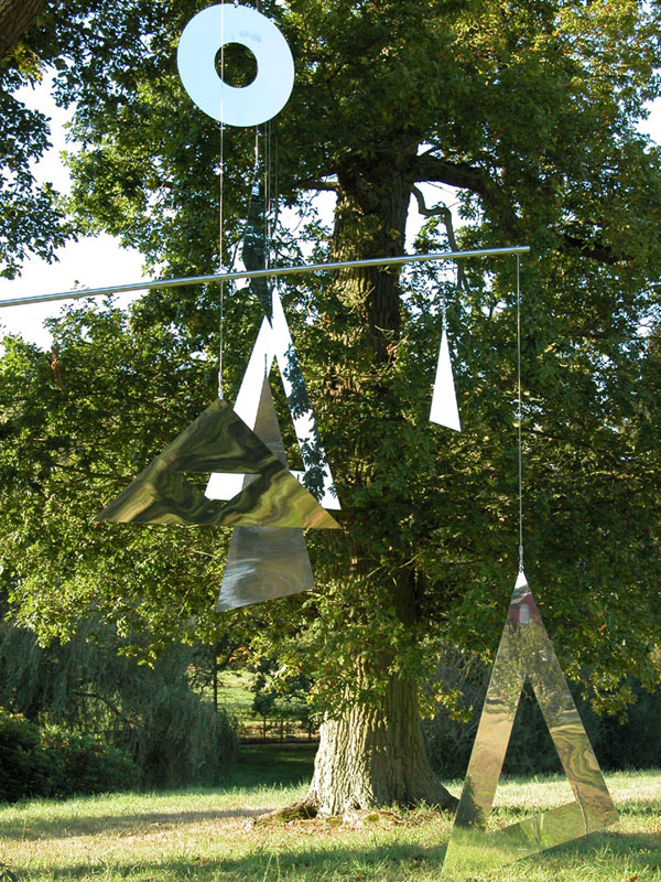 Hanging artwork from tree